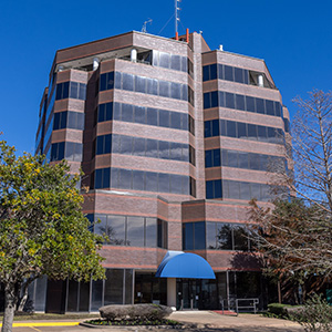 Exterior of multi-story brick building.