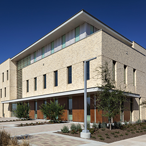 Exterior of brick building at the Texas A&M Higher Education Center at McAllen in McAllen, Texas.
